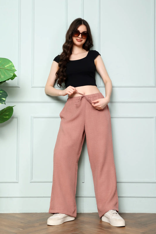 RABRIC dusty rose linen wide leg trousers for women standing front view with drawstring waist