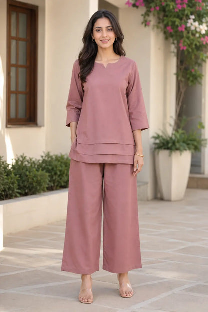 Rabric dusty rose solid cotton co-ord set for women with 3/4 sleeves, notch neck top, layered hem detail and wide leg pants front view