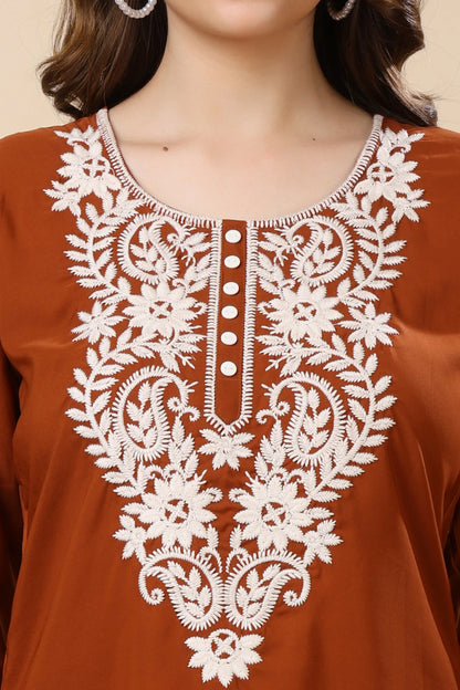 Close-up of embroidered V-neck crepe kurti design in rust brown by Rabric