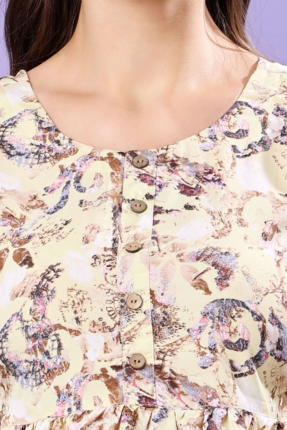 Closeup of Rabric Yellow Printed Short Kurti Fabric & Neckline