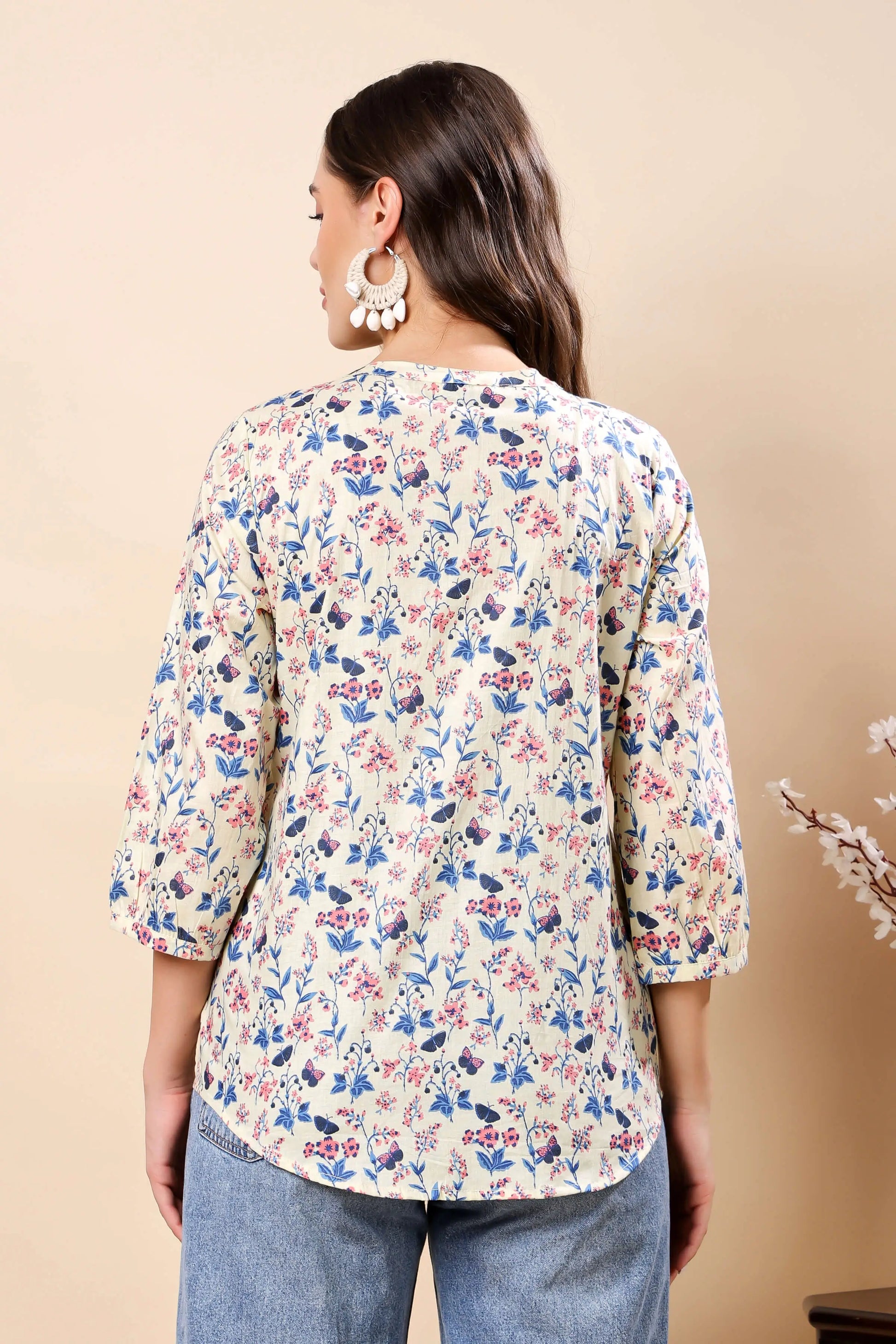 Back view of Rabric floral short top with full sleeves