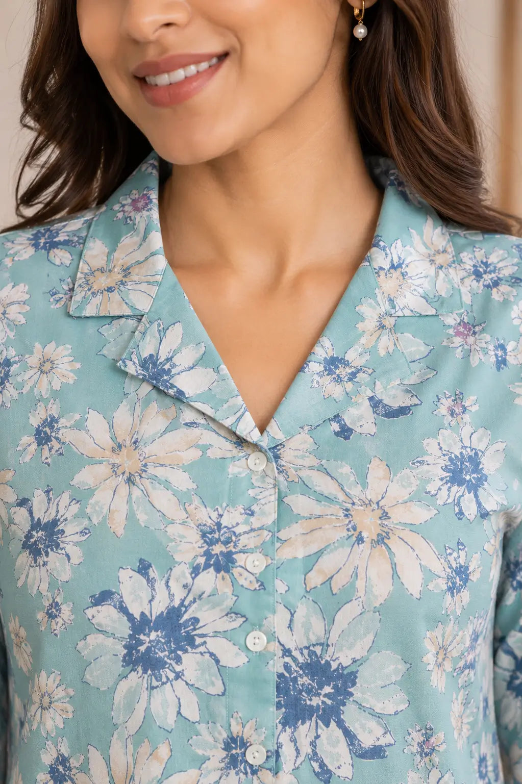 Closeup collar neck design of Rabric blue floral glace cotton women night suit co-ord set with button detailing