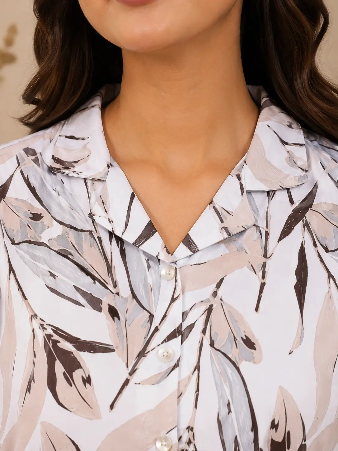 Close up neck design of Rabric glace cotton leaf print women night suit featuring soft collar and button detailing