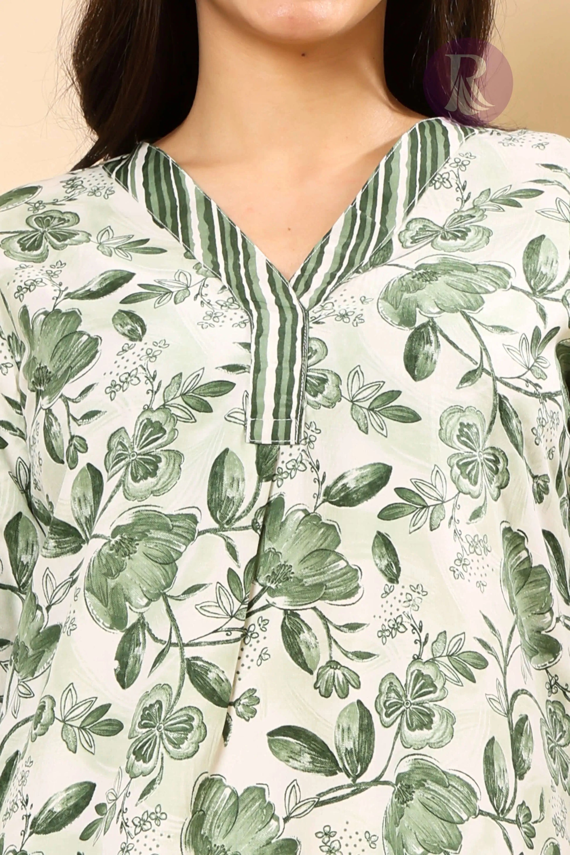 V-neck cotton slub kurti with thread work in green floral print