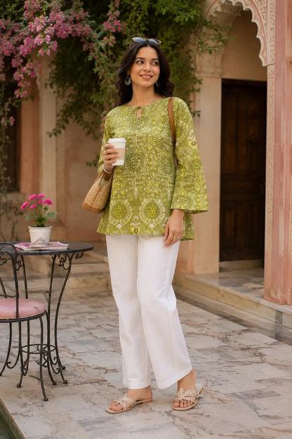 Full length look of RABRIC green summer kurti paired with white straight pants