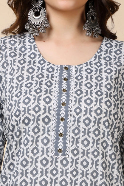 Close-up of round neckline and brass button detailing on grey cotton kurti