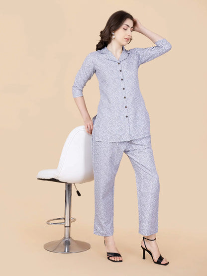 Detailed view of grey floral print on glace cotton fabric