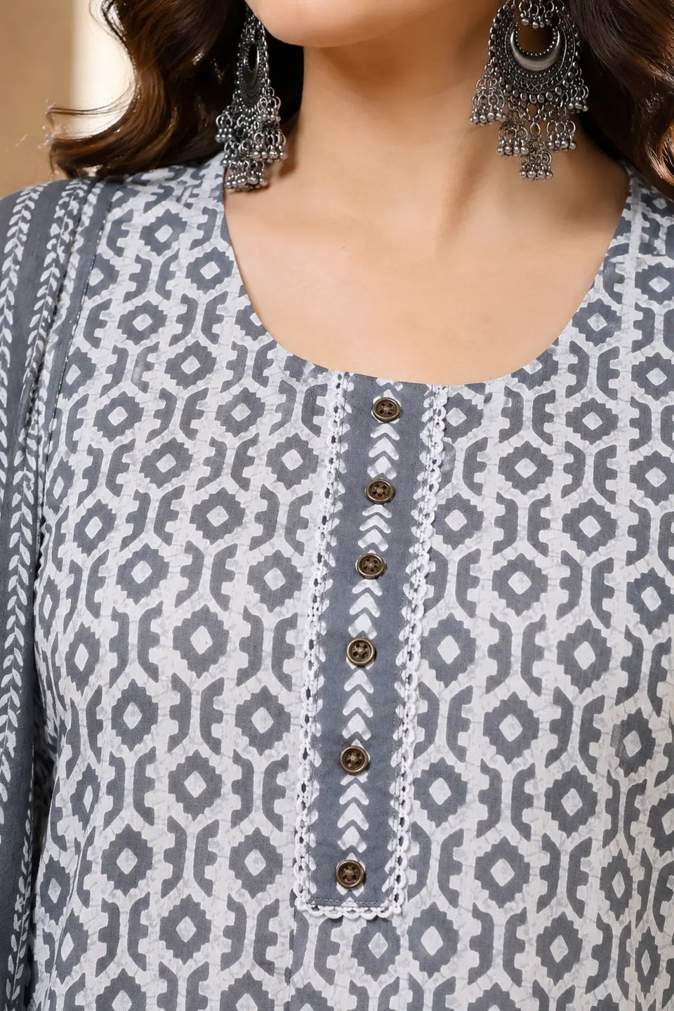 Close up neck design detail of Rabric grey white cotton kurta with button placket and ethnic printed pattern for women