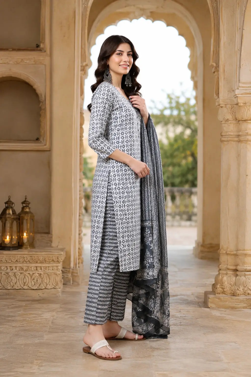 Side angle view of Rabric grey white cotton kurta pant set with dupatta for women featuring straight fit long kurta and ethnic print