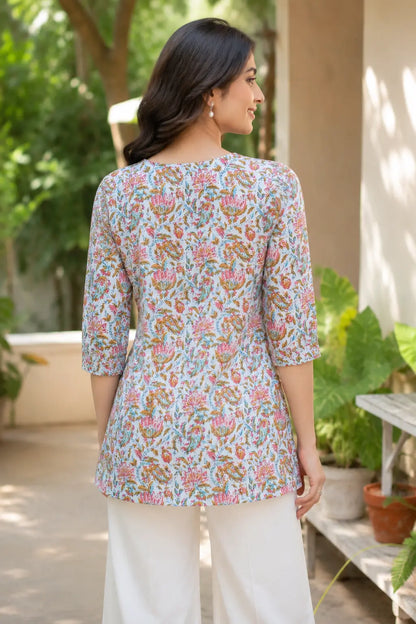 Back view of Rabric light blue floral cambric cotton short top for women with elegant flare and 3/4 sleeves