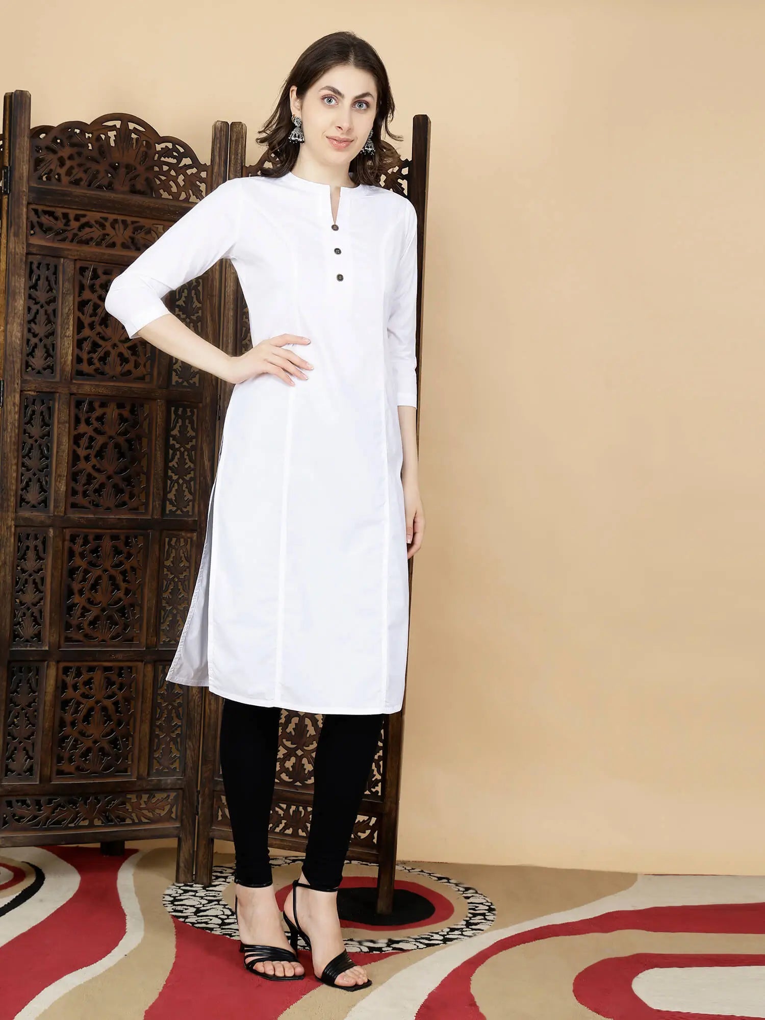 Model wearing Rabric white cotton long kurti with black leggings