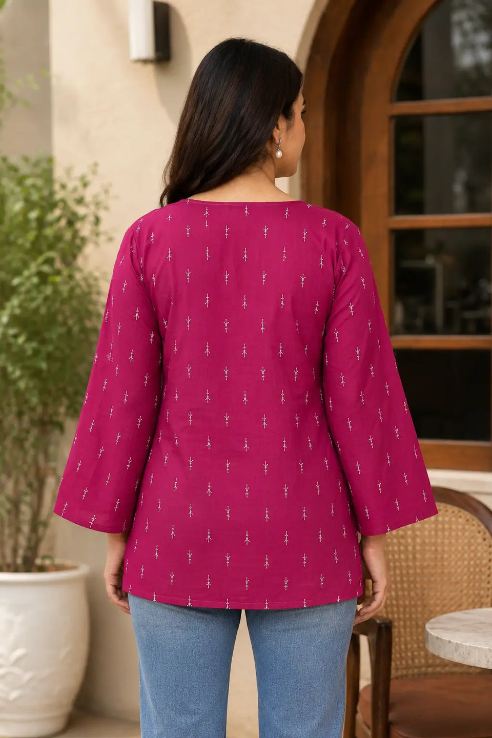 Back view of Rabric magenta cotton wrap short top featuring white buti print and stylish bell sleeves for women