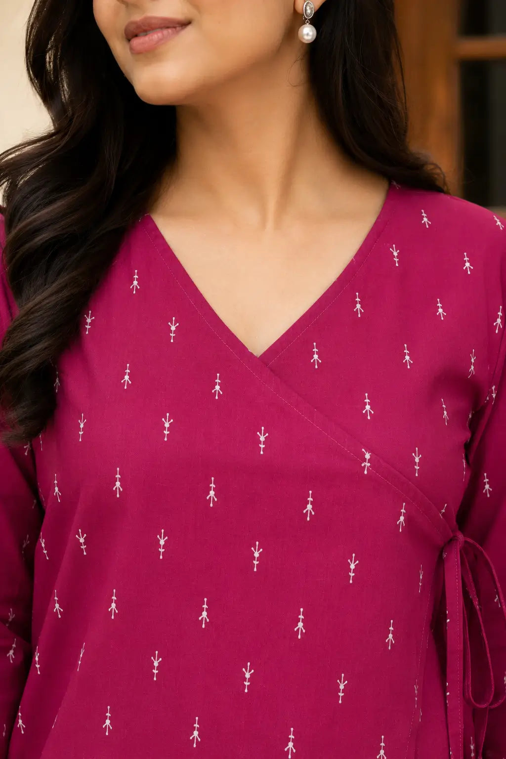 V neck wrap style neckline closeup of Rabric magenta cotton short top with white buti print