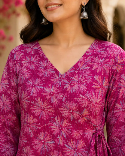 Closeup of V neck design on Rabric magenta pink cotton floral print short top for women.