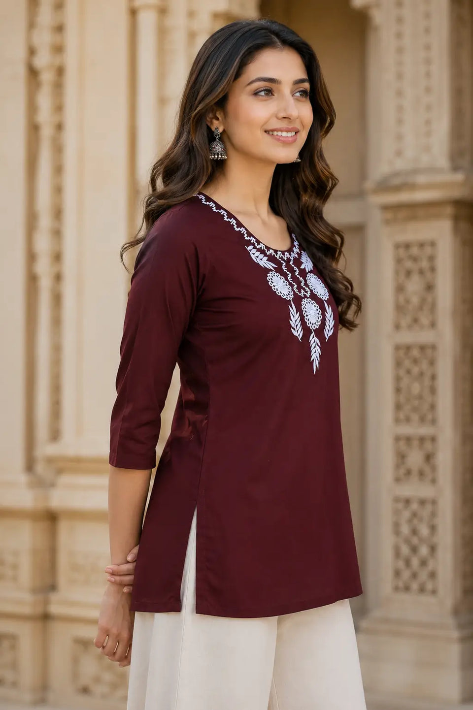 Side angle view of Rabric maroon cambric cotton short top for women featuring stylish fit and embroidered neckline