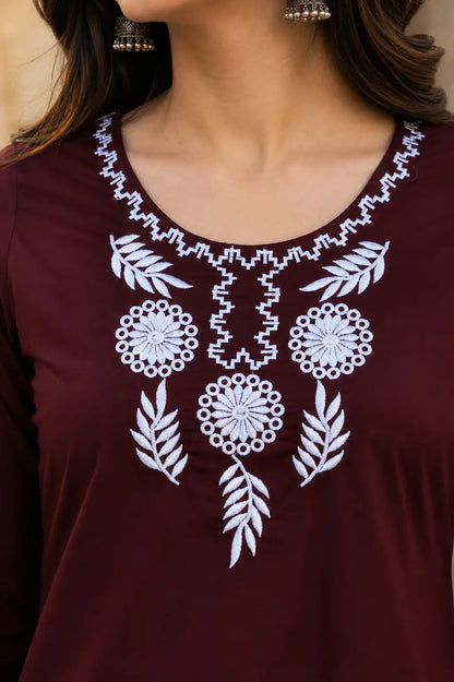 Close up neck design of Rabric maroon cotton embroidered short top with floral white thread embroidery for women