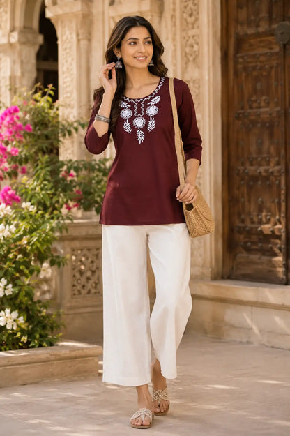 Woman wearing Rabric maroon cotton embroidered short top with stylish casual ethnic lifestyle fashion look