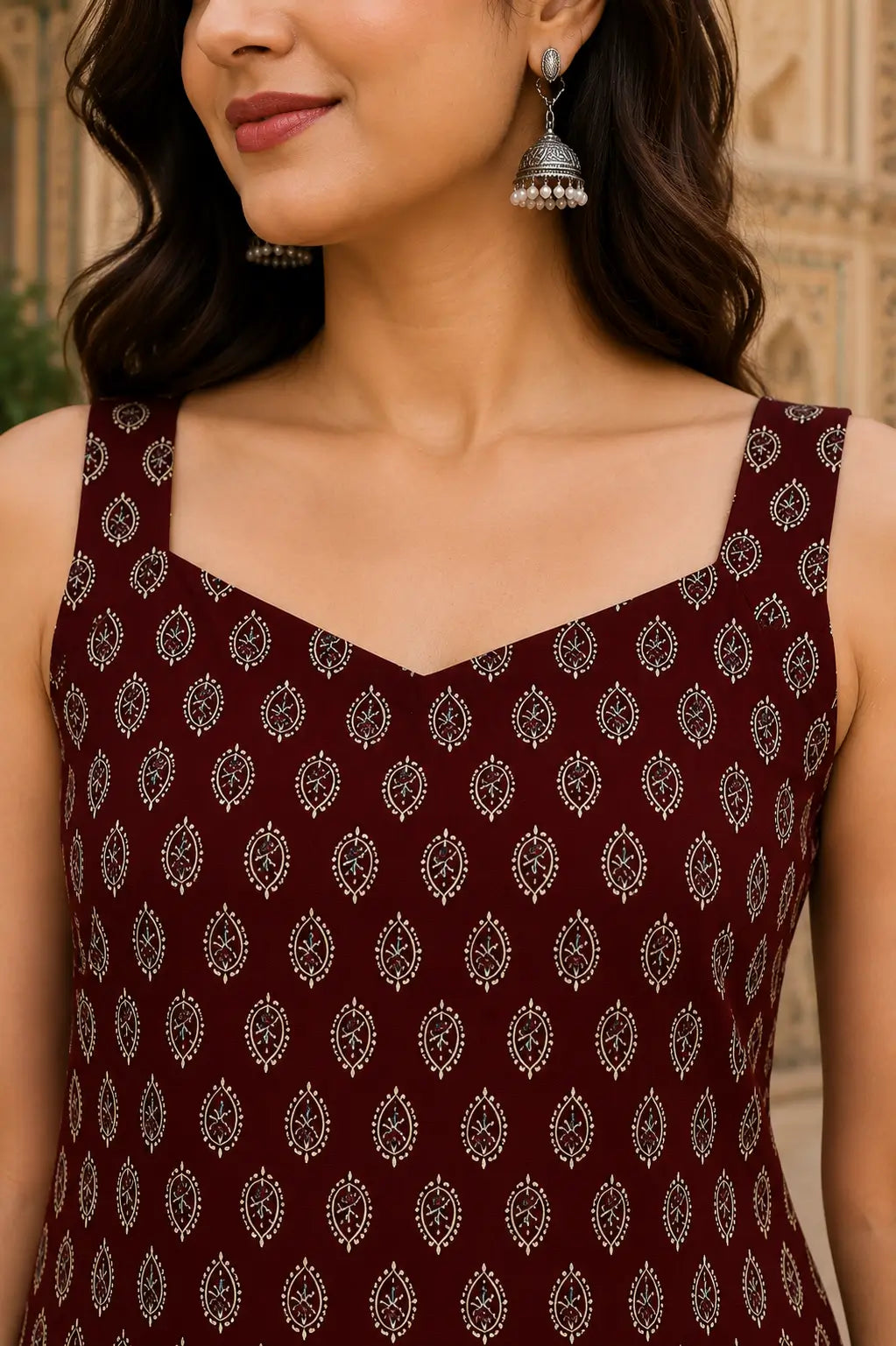 Sweetheart neck closeup of Rabric maroon pure cotton sleeveless short top featuring traditional paisley leaf print and premium cotton fabric