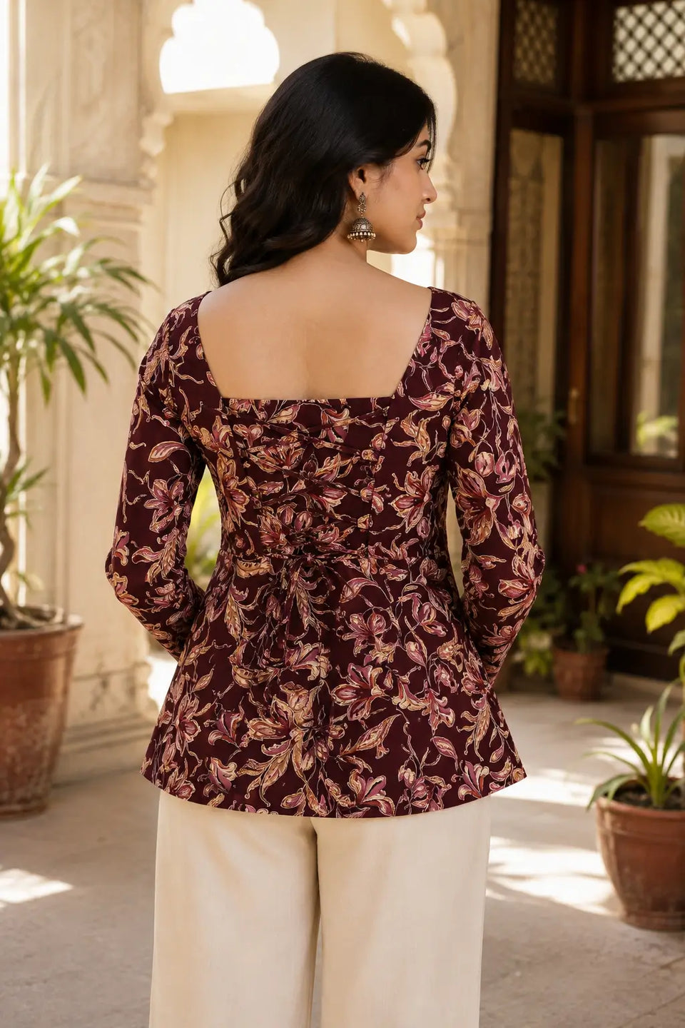 Rabric maroon floral print cotton short top with stylish back dori lace-up design, square back neck and full sleeves back view.