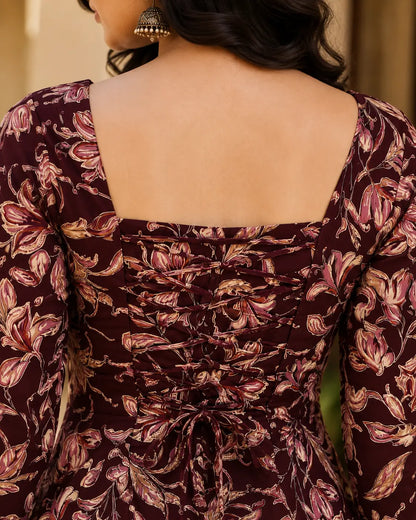 Closeup of Rabric maroon floral print cotton short top featuring adjustable back dori lace-up detailing and botanical floral print.