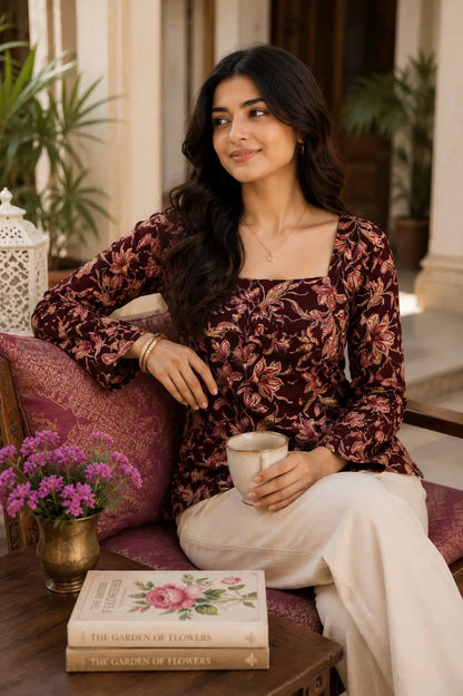 Rabric maroon floral print cotton short top styled in a relaxed sitting pose with casual accessories and comfortable everyday wear look.