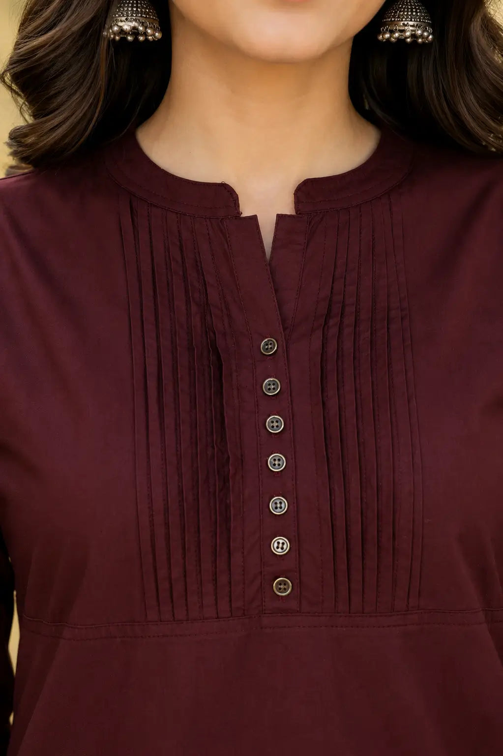 Close up neck design of Rabric maroon popline cotton kurti with pintuck pleats and button detailing for women