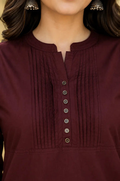 Close up neck design of Rabric maroon popline cotton kurti with pintuck pleats and button detailing for women