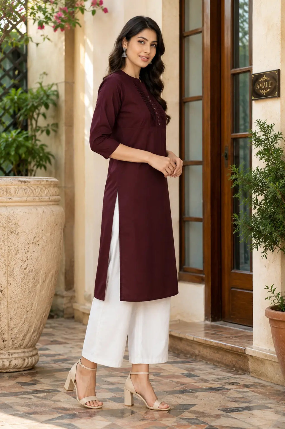 Side angle view of Rabric maroon popline cotton straight fit kurti for women with side slit and 3/4 sleeves