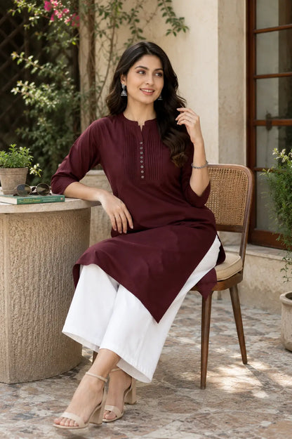 Rabric maroon popline cotton women kurti in casual sitting pose with elegant accessories and comfortable ethnic fashion