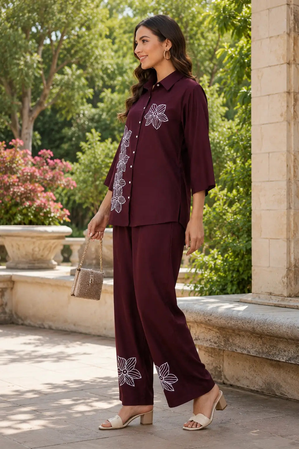 Side view of Rabric maroon rayon co-ord set for women with white flower embroidery on shirt and pant hem