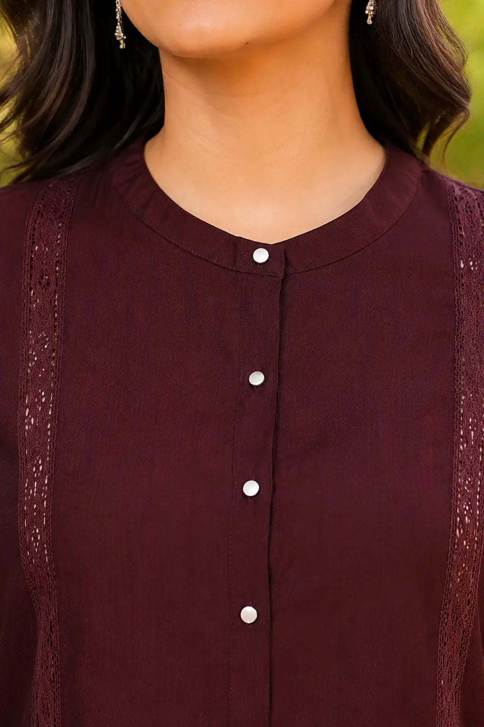 Close-up of round neck and front button detailing on Rabric maroon vertican silk women's co-ord set with premium lace accents.