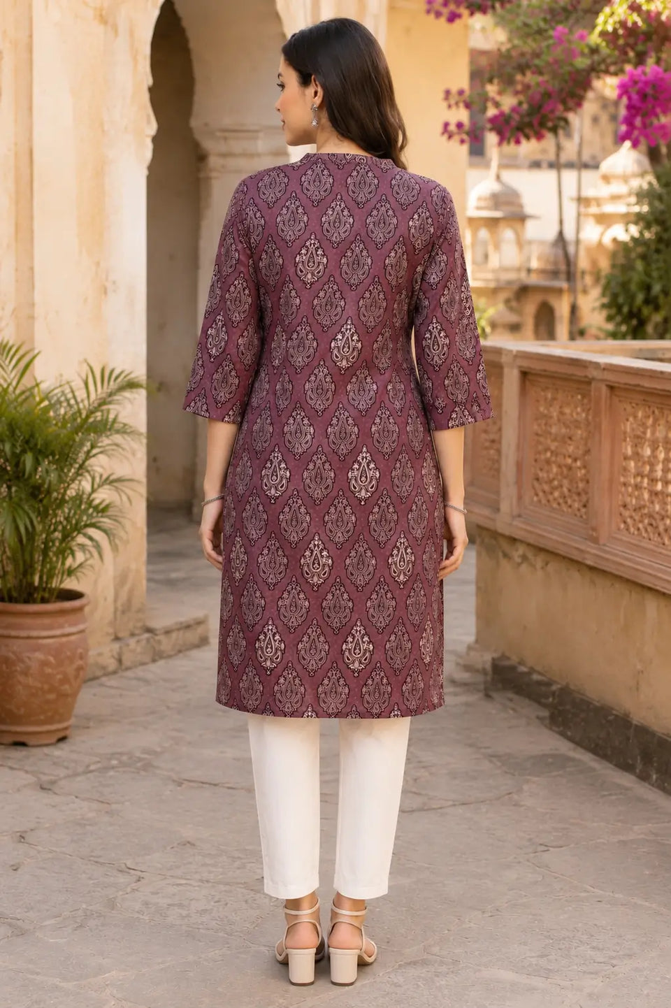 Back view of Rabric mauve cambric cotton women kurti with elegant paisley print and straight fit design