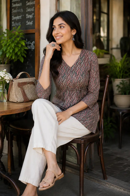 Rabric multicolor printed cotton short top sitting lifestyle image featuring soft breathable cambric cotton and elegant casual styling