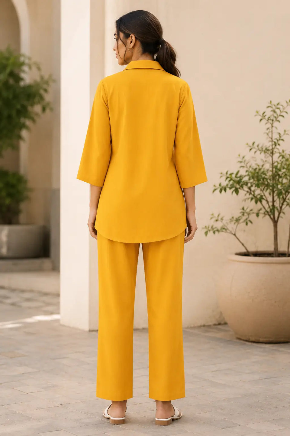 Back view of Rabric mustard yellow rayon co-ord set for women featuring plain back collared shirt, relaxed straight pants and premium soft rayon fabric