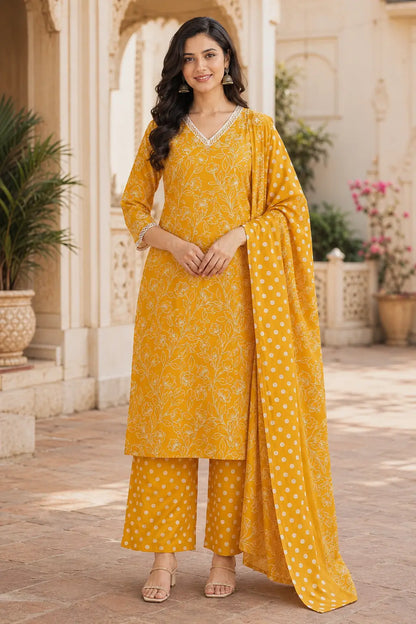 Rabric mustard yellow cotton kurta pant set with dupatta for women featuring white floral vine print, V neck lace detailing, 3/4 sleeves and matching polka dot pants.