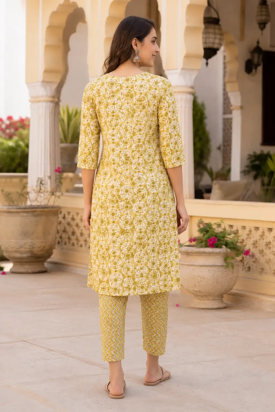 Back view of Rabric mustard yellow rayon kurta pant set for women with printed straight fit kurta and matching pants