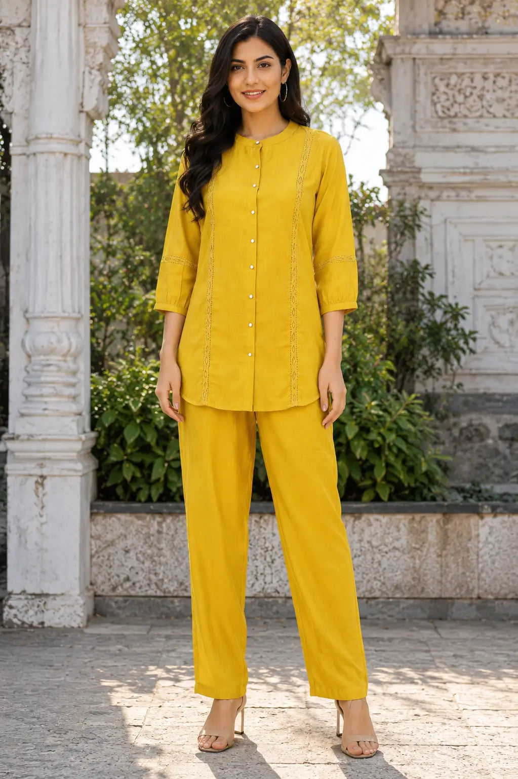 Rabric mustard yellow Vertican Silk women co-ord set front view featuring button-down shirt, round neck design, lace panel detailing, 3/4 sleeves and matching straight pants.