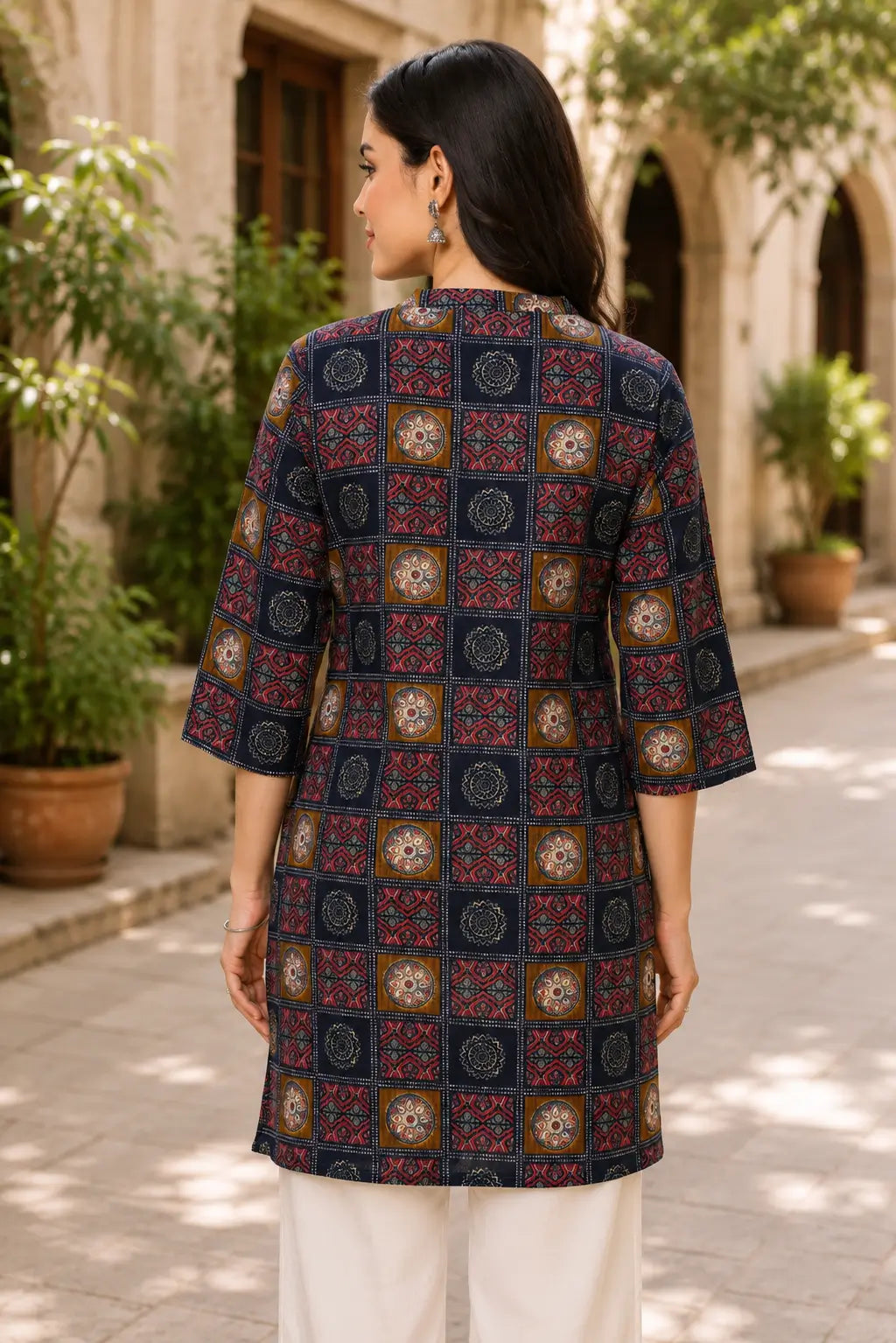 Back view of Rabric navy blue cotton flex printed women kurti with elegant ethnic print and mid length design