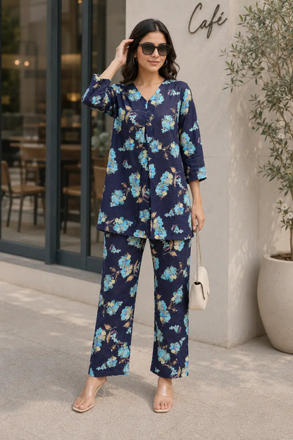 Rabric navy blue cotton floral print casual co-ord set for women styled with handbag sunglasses and heels
