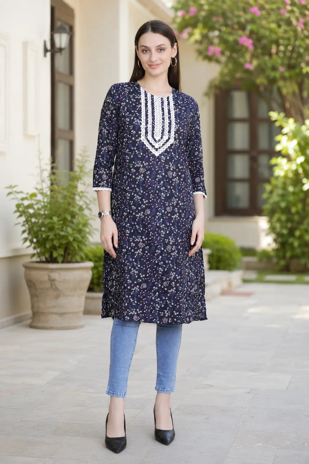 Rabric navy blue cotton floral printed long kurti for women with V-neck white embroidery design, 3/4 sleeves and side slits, front view.