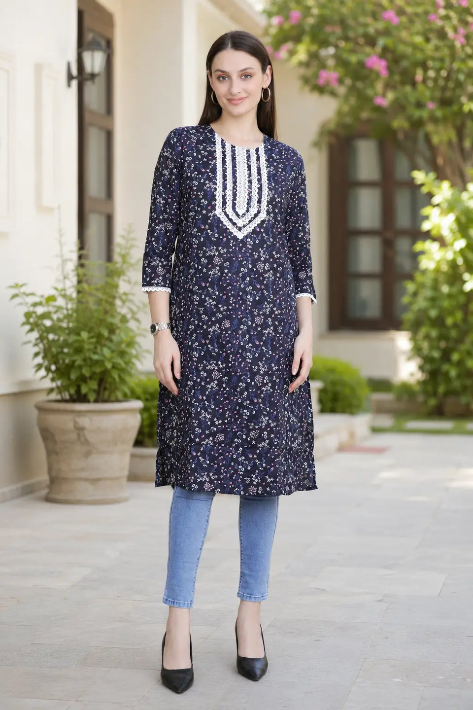 Rabric navy blue cotton floral printed long kurti for women with V-neck white embroidery design, 3/4 sleeves and side slits, front view.
