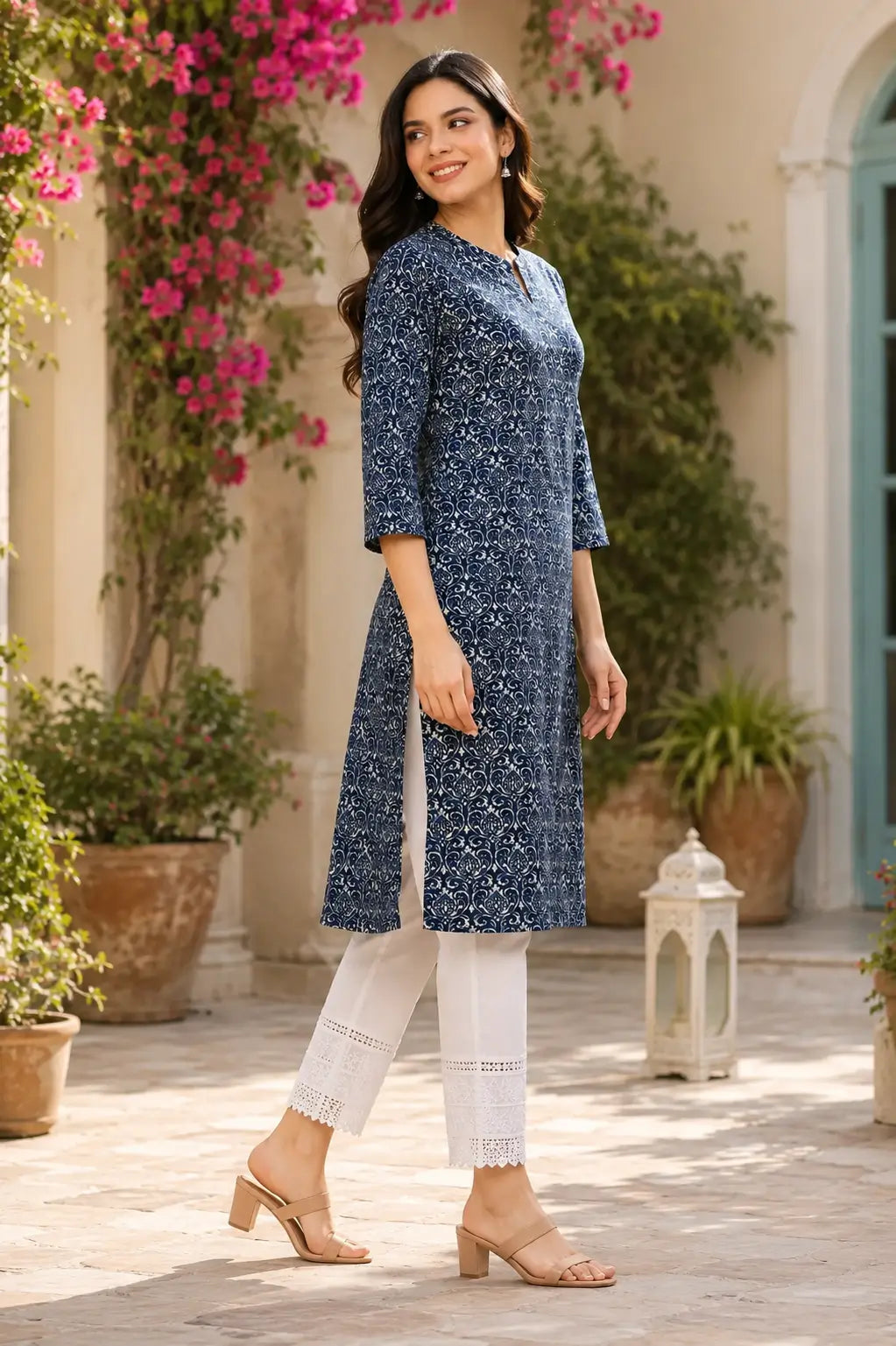 Side angle view of Rabric navy blue cotton printed kurti for women with 3/4 sleeves and stylish straight silhouette