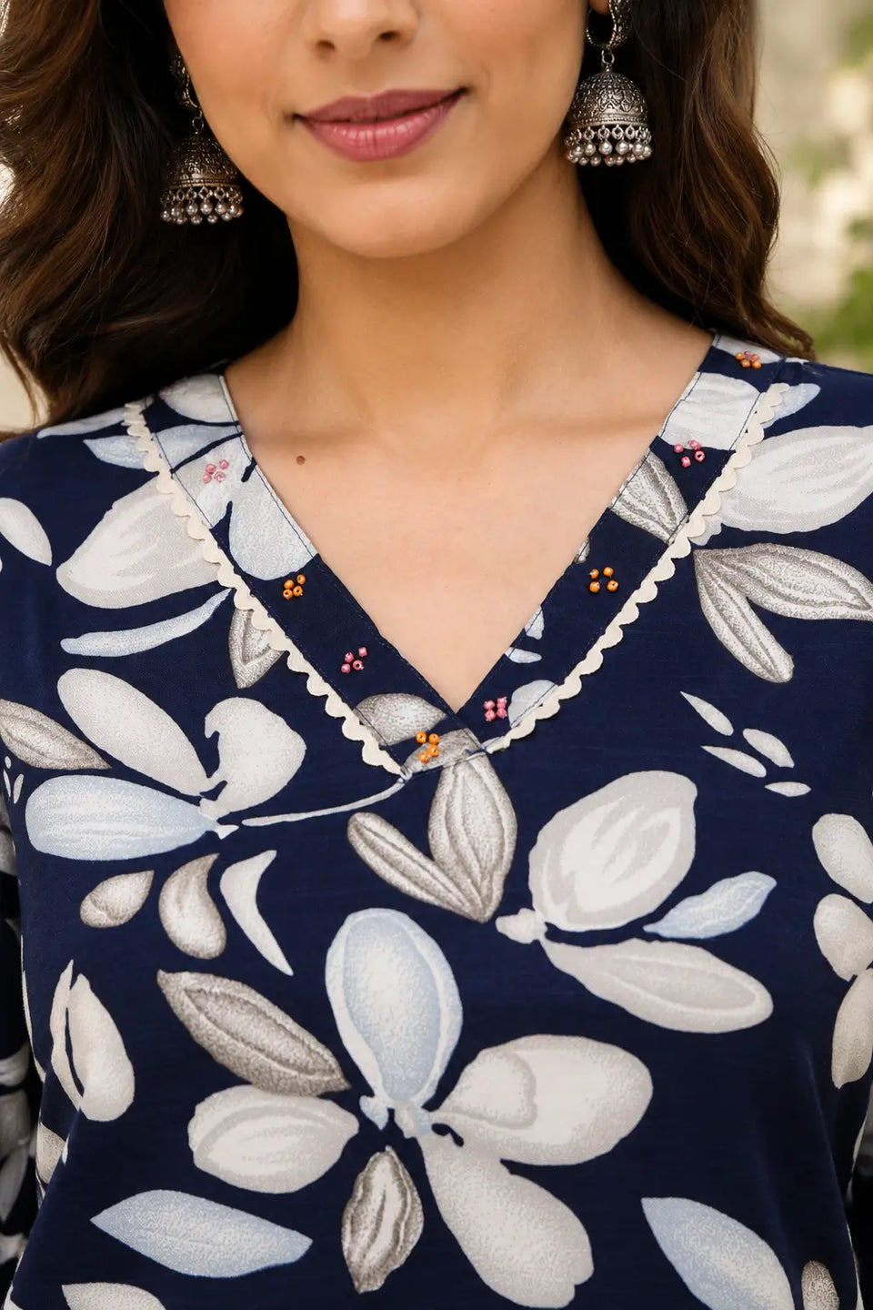 Close-up of Rabric navy blue cotton floral co-ord set V-neck design with scallop trim and bead detailing