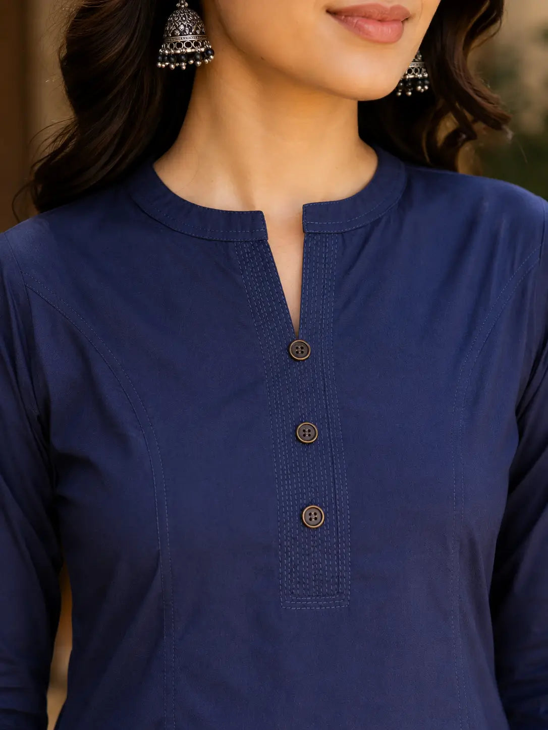 Close up neck design of Rabric navy blue popline cotton women kurti with stylish button placket detailing