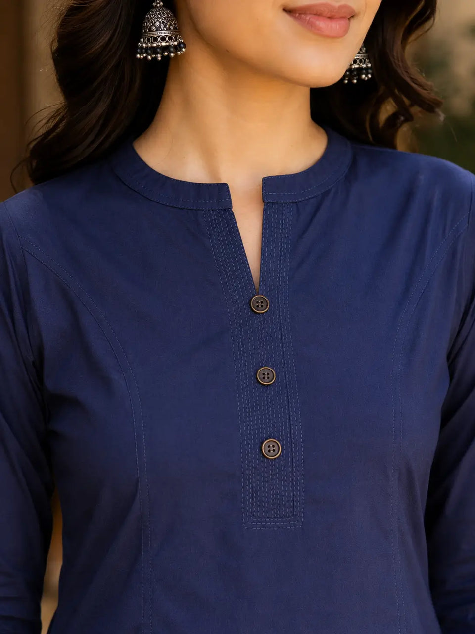 Close up neck design of Rabric navy blue popline cotton women kurti with stylish button placket detailing