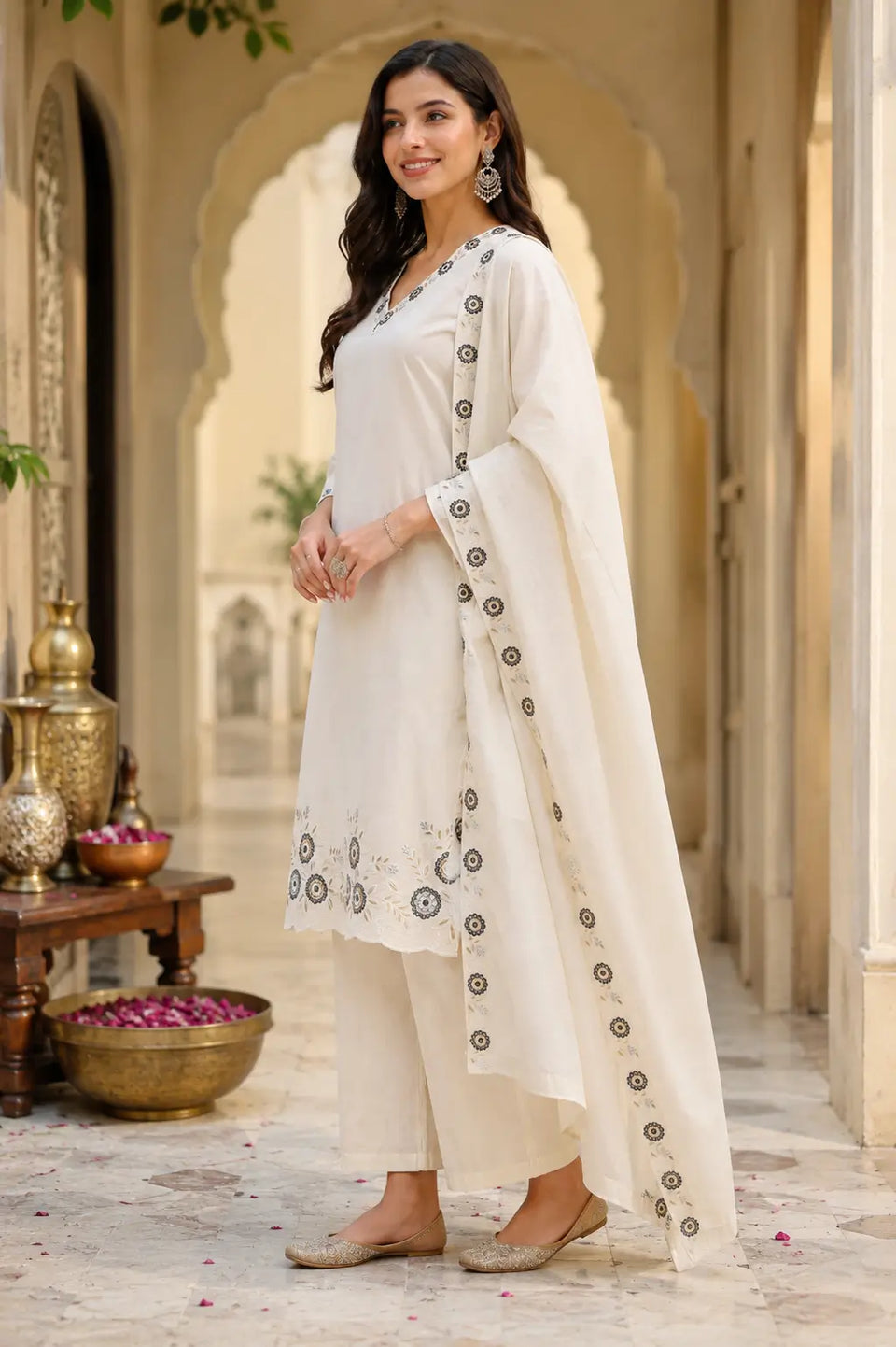 Side angle view of Rabric off white cambric cotton embroidered kurta pant set with matching dupatta for festive and casual wear