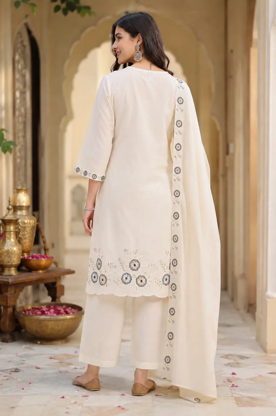 Back side view of Rabric off white cambric cotton kurta pant set with dupatta featuring floral embroidered hem and plain cotton pants