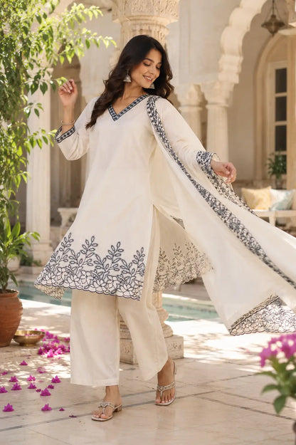 Rabric off white cambric cotton embroidered kurta pant set with flowing dupatta in graceful dancing pose for women fashion