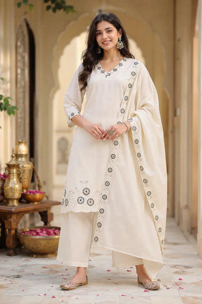 Lifestyle image of woman wearing Rabric off white cambric cotton kurta pant set with dupatta and casual accessories