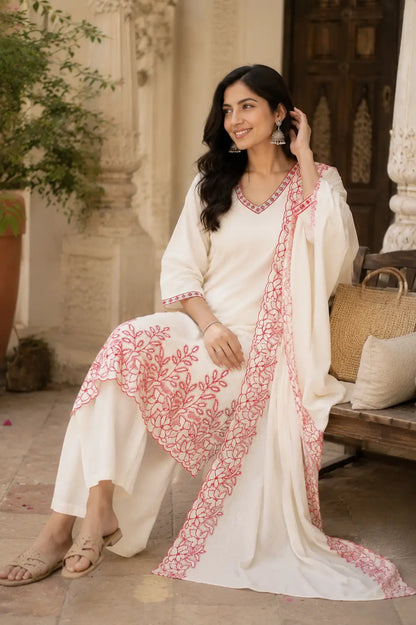 Lifestyle sitting pose image of Rabric off white cambric cotton embroidered kurta pant set with dupatta for elegant daily wear